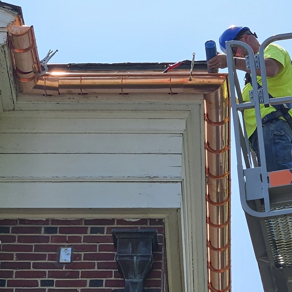 One of our team members installing a copper gutter.